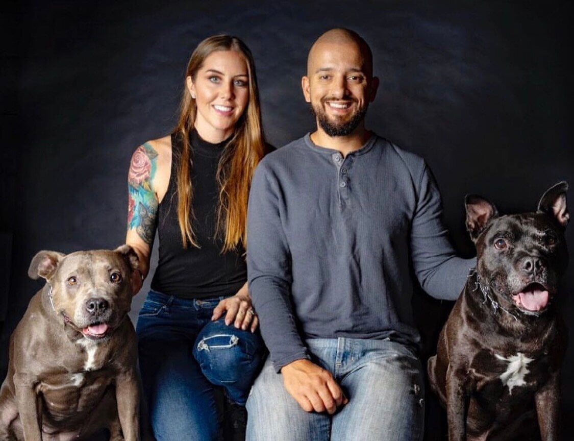 Erin and her husband with dogs